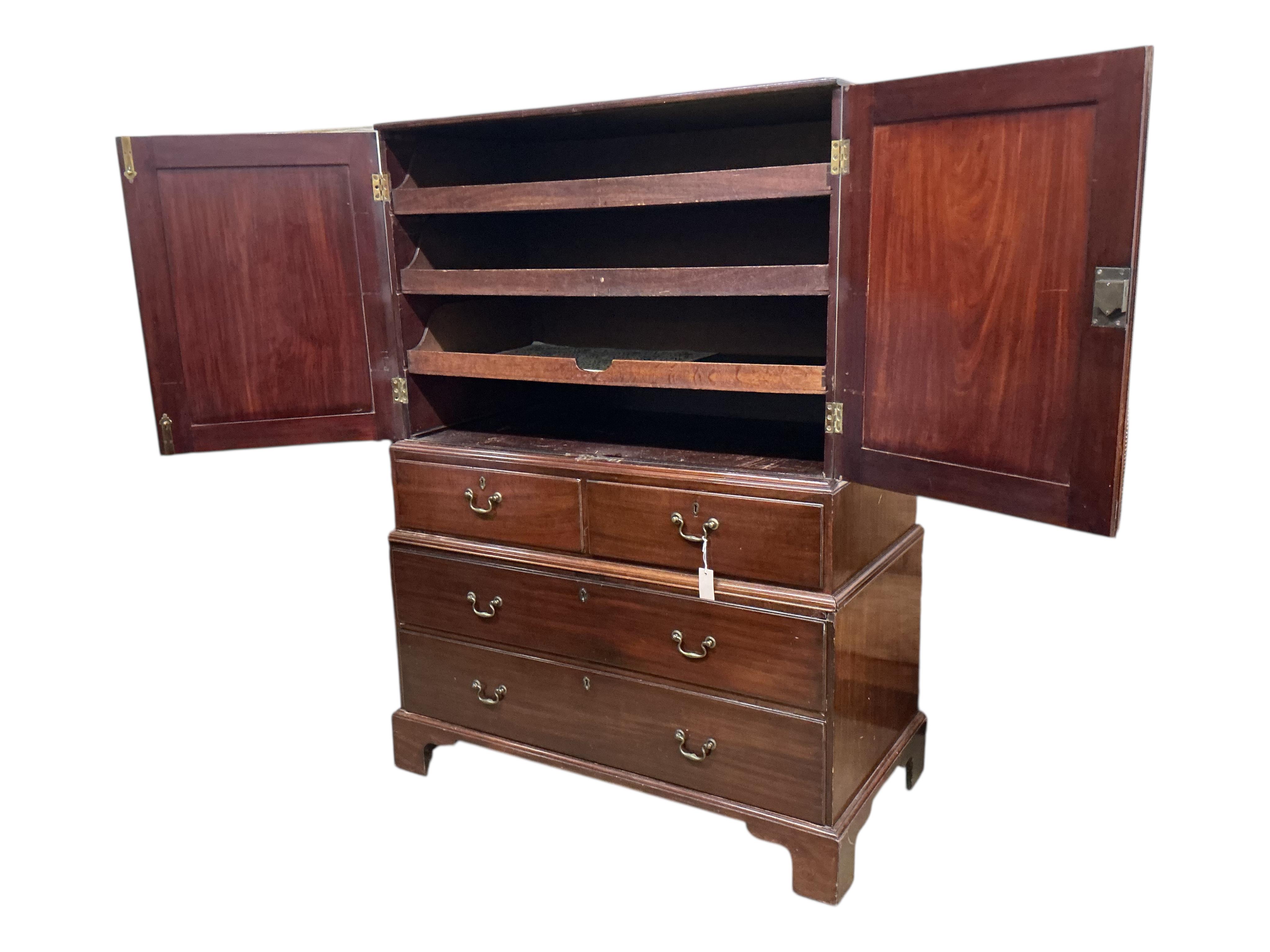 A George II mahogany three part linen press, width 122cm, depth 62cm, height 166cm